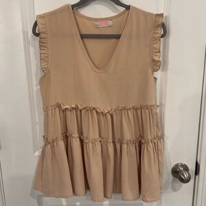 Tan, sleeveless blouse